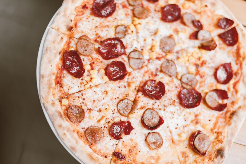 Round Table Signature pizza with premium toppings